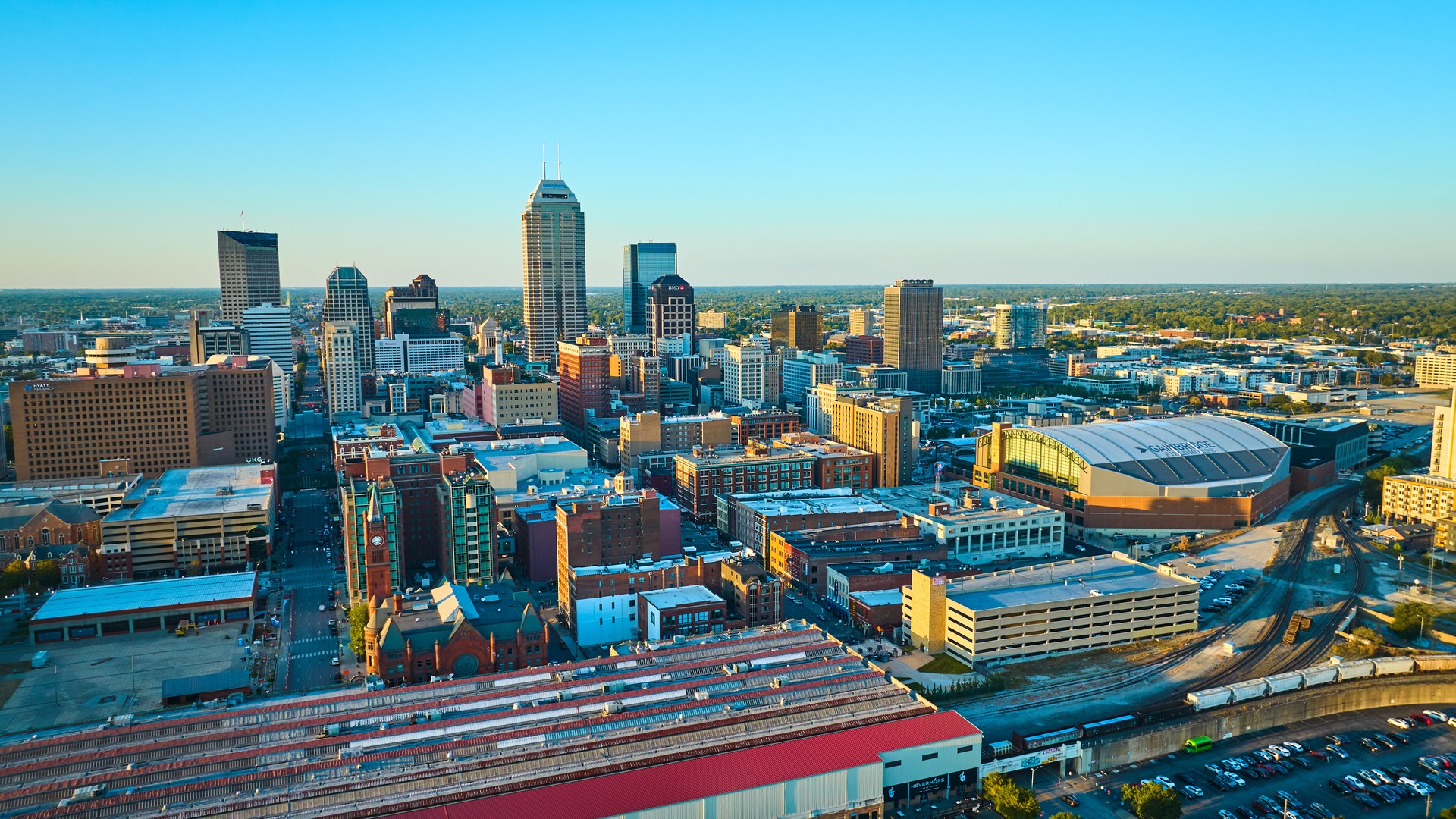 Indianapolis skyline and stadium at golden hour for a 2026 Final Four trip planning guide
