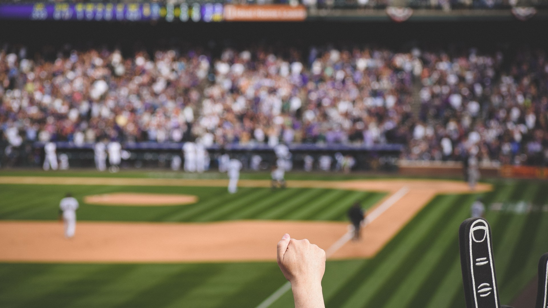 Baseball stadium with crowd for MLB postseason travel planning