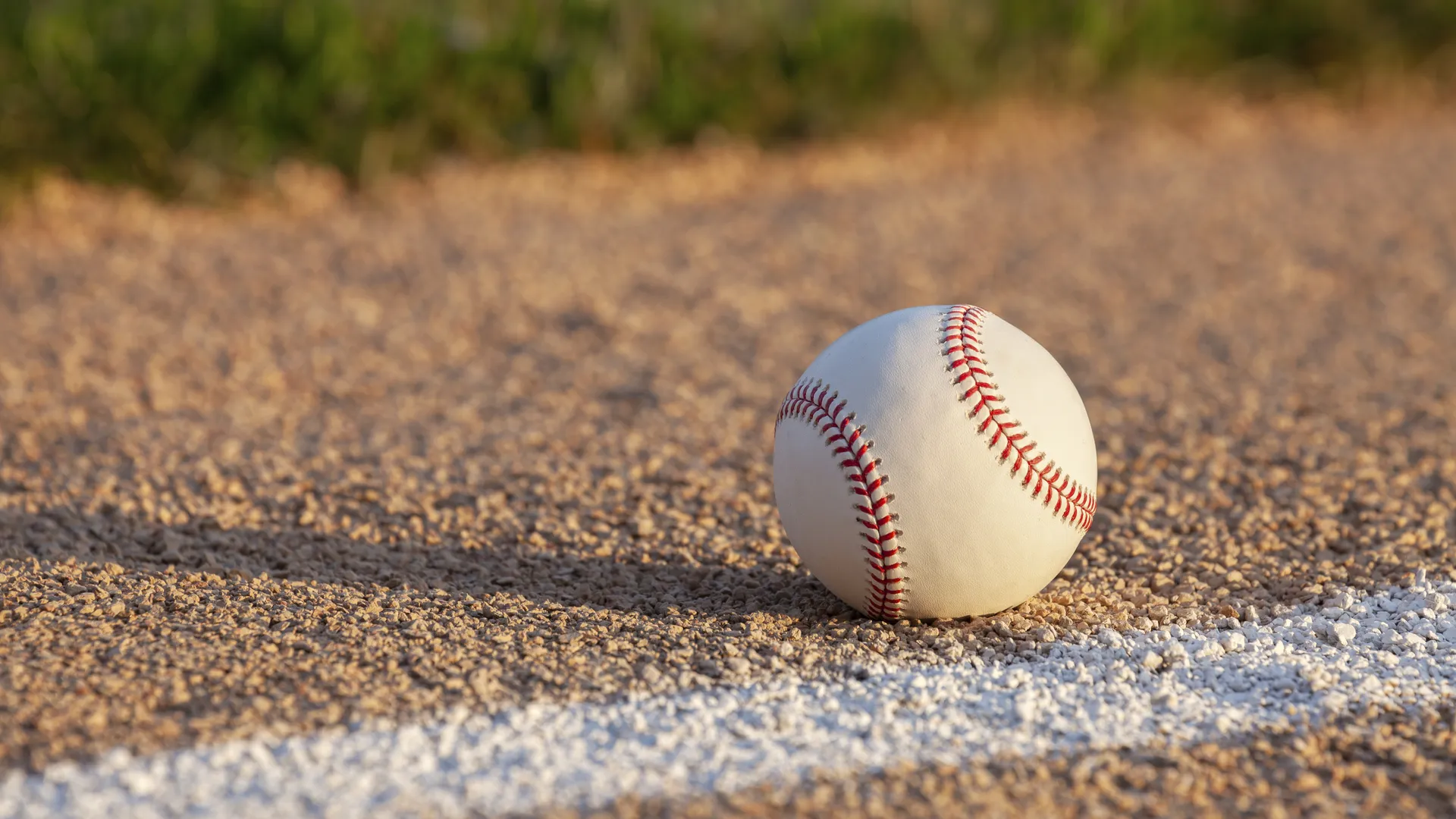 Baseball on a basepath for a guide to the best baseball road trip routes across America
