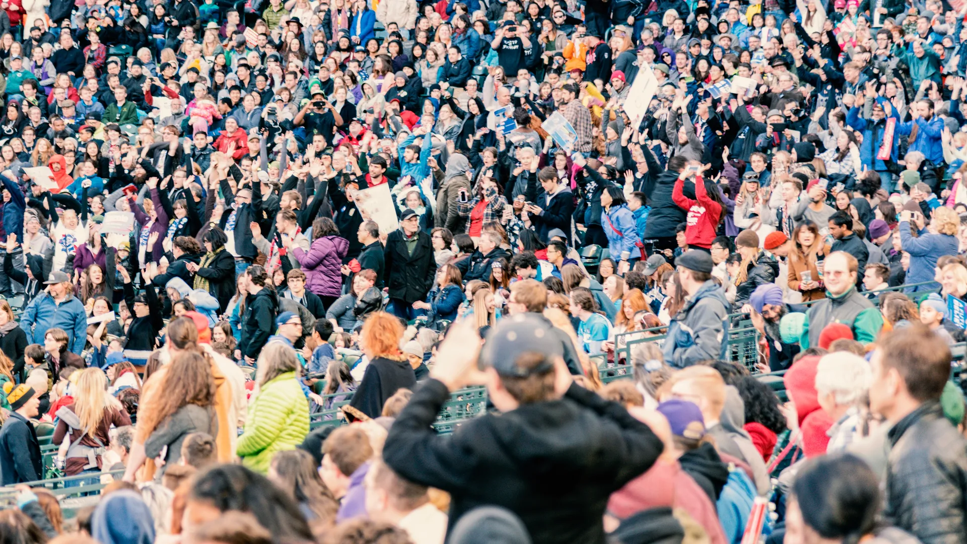 Crowd cheering in stadium seating for a first-time NFL stadium visit guide