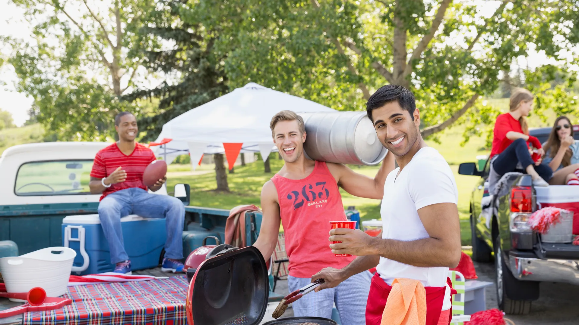 College football fans relaxing at a tailgate barbecue