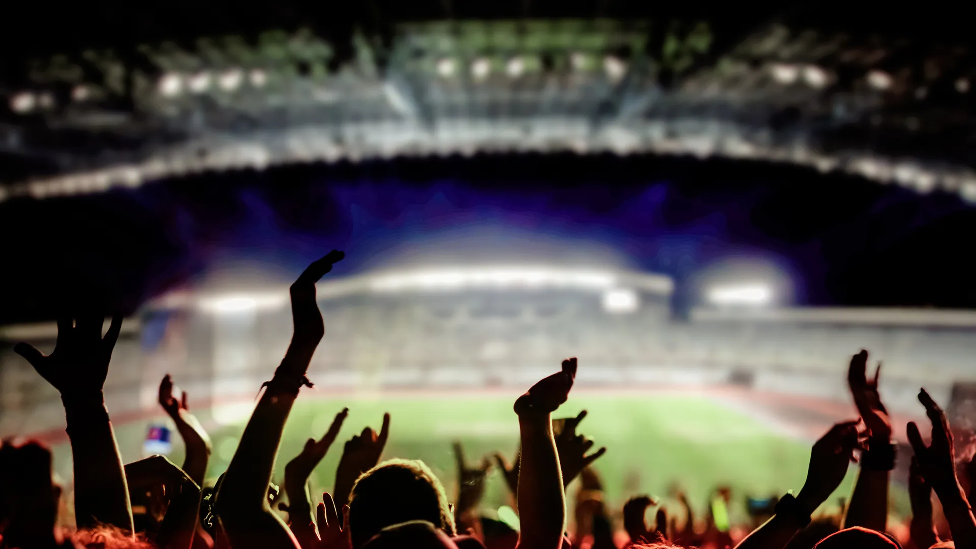 Fans filling a stadium for a fall sports event