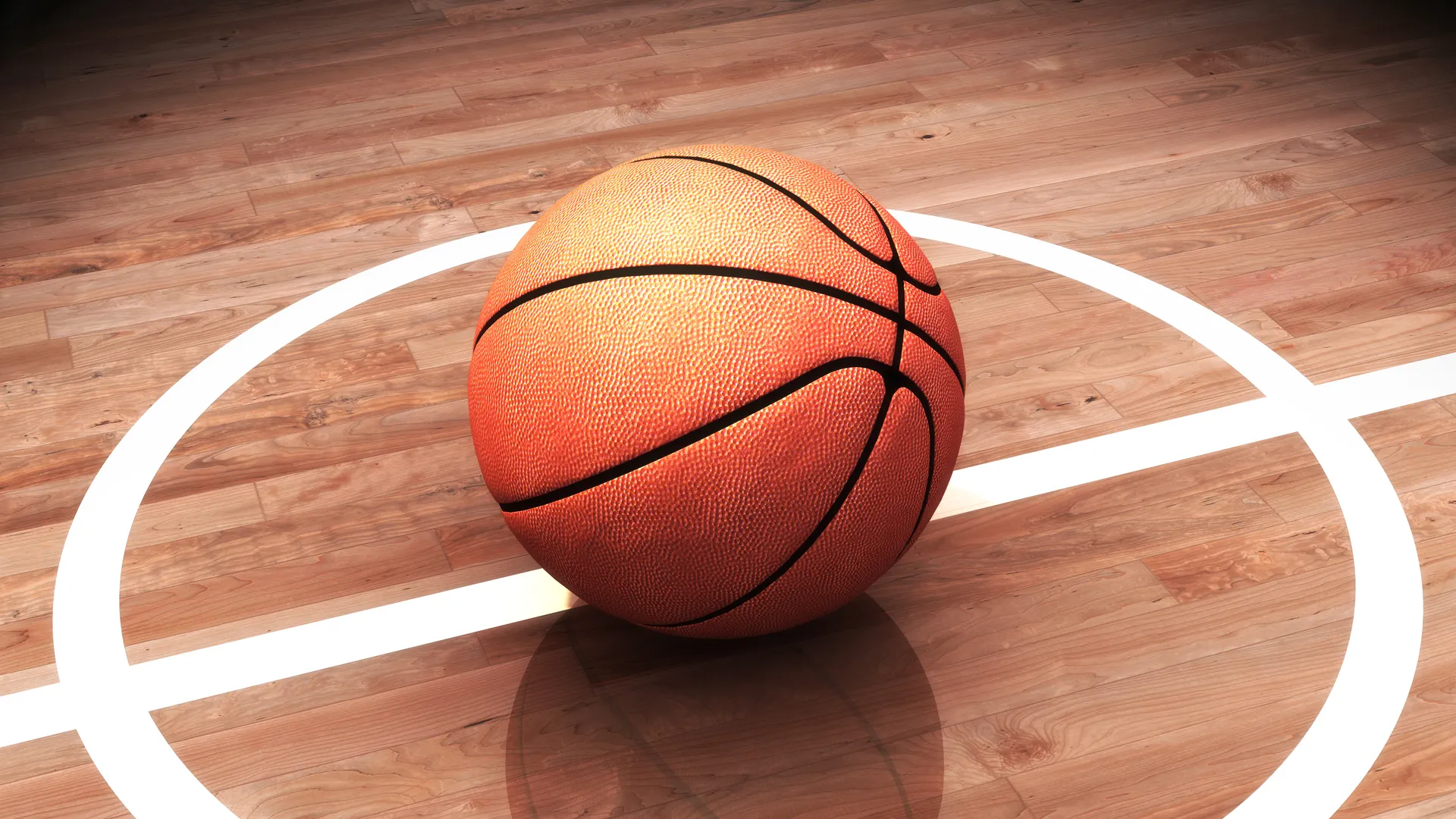Basketball on a lit court for tournament travel planning