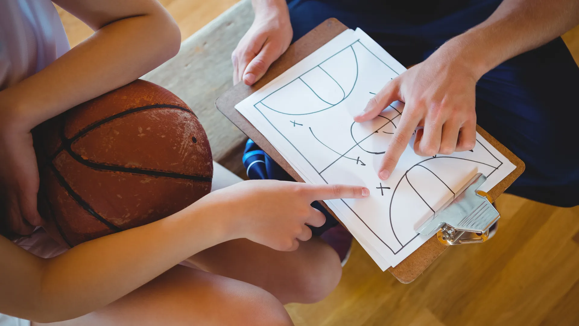 Basketball strategy diagram representing March Madness bracket travel planning