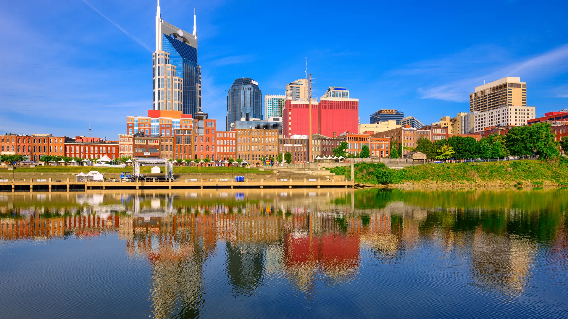 Nashville skyline over the Cumberland River for a Music City sports travel guide.