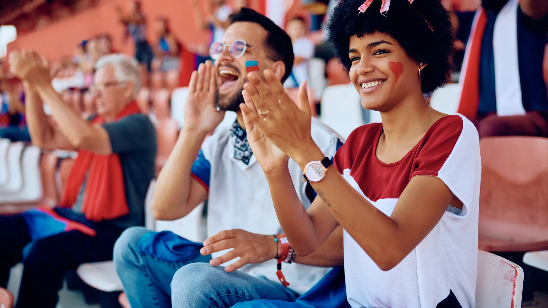Basketball fans cheering in a stadium for an NBA Finals travel guide.