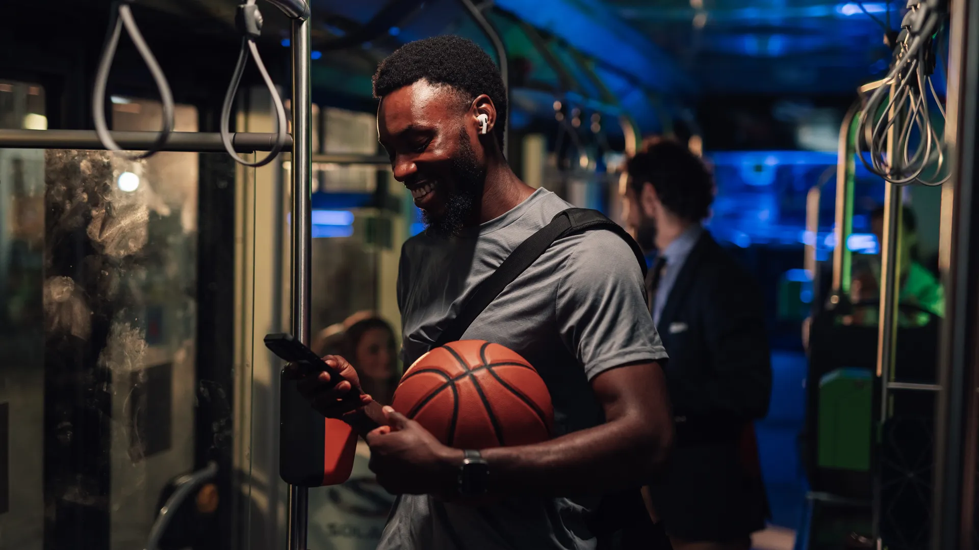 Basketball fan on a night bus for an NBA playoff road trip travel guide