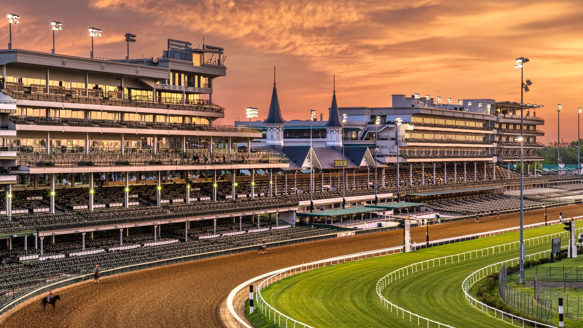 Horse racing track at sunset for a Triple Crown race comparison guide