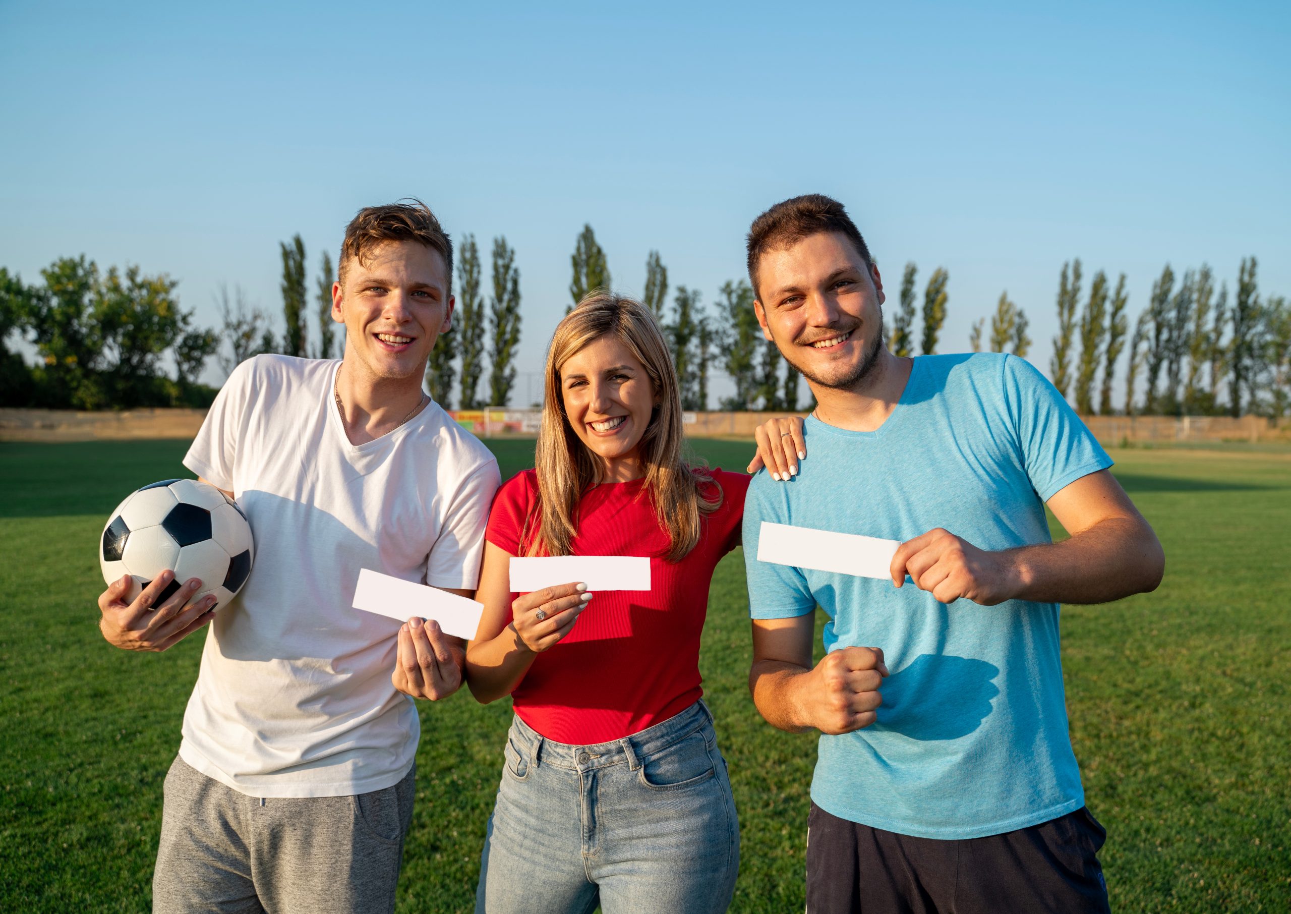 Group of soccer fans holding match tickets and smiling, illustrating ticket-buying decision for a 2026 World Cup trip